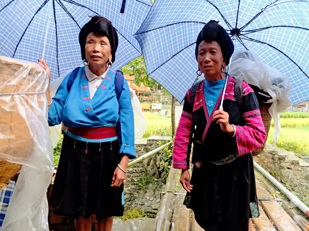 China - Longsheng - two women belonging to the Yao ethnic minority group, located in the famous Longji Rice Terraces